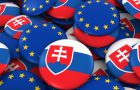 Slovakia and EU Badges Background - Pile of Slovakian and European Flag Buttons 3D Illustration